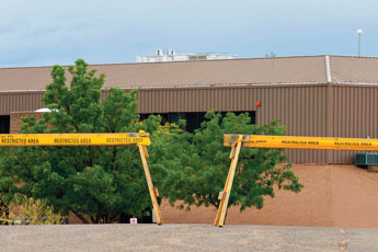 The parking lot to an administration building is blocked after mold was found in the building. &copy; 2011 Gallup Independent / Brian Leddy 